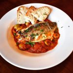 Seabass with preserved lemon, tomato and olive sauce